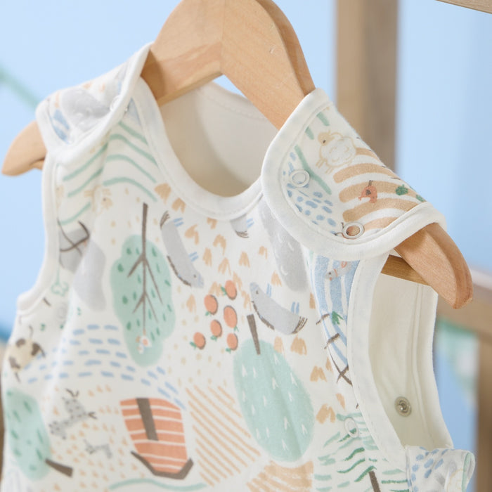 Close-up of the Good Life baby sleep bag neckline with popper detail, showcasing soft cream lining and gentle pastel print
