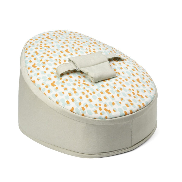 Angled cutout view of the Run Wild baby beanbag showing rounded silhouette, neutral fabric sides and vibrant safari-inspired print