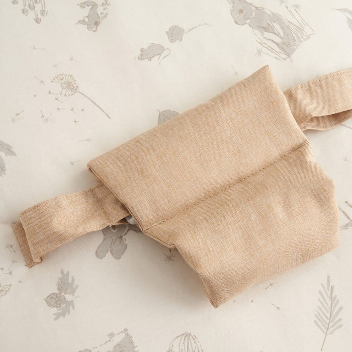 Detailed view of the Cocoon baby bean bag safety strap, highlighting secure fastening and soft fabric for gentle, supported lounging
