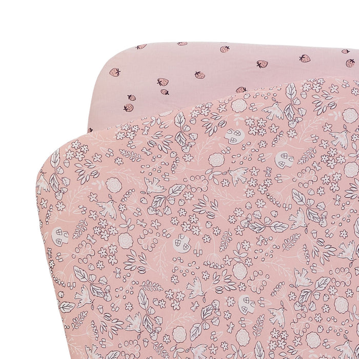 Pack of 2 bedside crib fitted sheets with a floral-patterned fabric and a strawberry one, on a white background