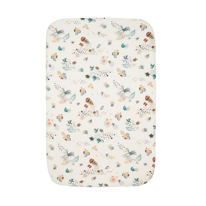 Full view of Our Planet bedside crib fitted sheet featuring ocean-inspired design with turtles, starfish, and sea plants on soft cotton
