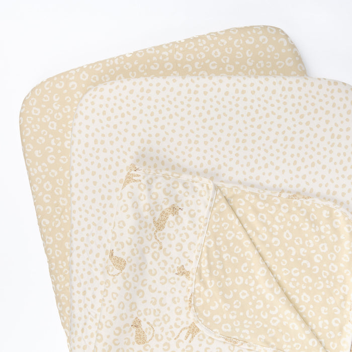 Love Cats bedside crib starter pack featuring matching fitted sheets and a reversible coverlet on a white background