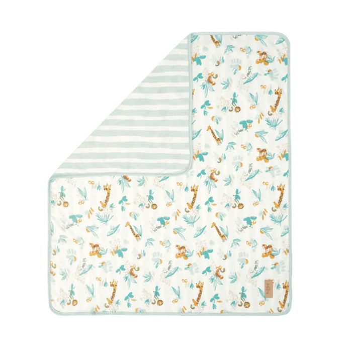 Folded corner cutout of Run Wild 
coverlet, reversible quilted organic cotton with woodland animal prints for softness and cosy style