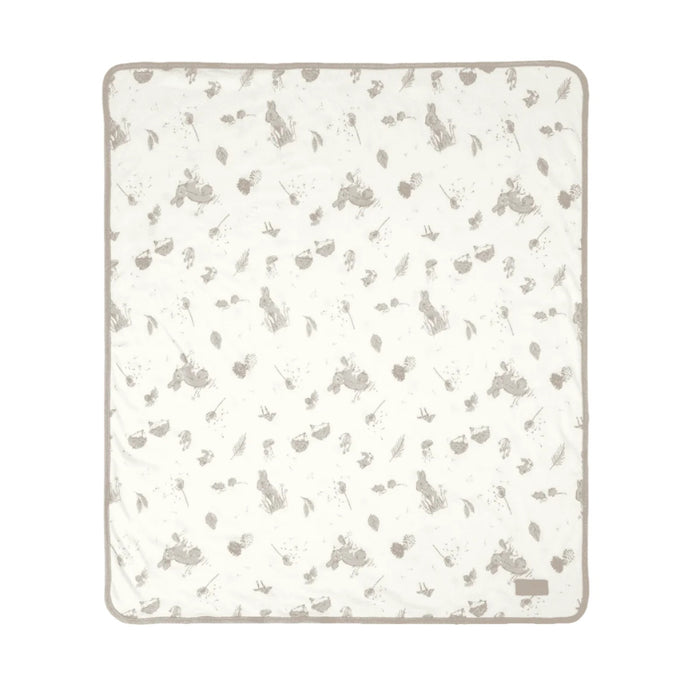 Open lay cutout of Cocoon coverlet, quilted organic cotton with woodland animal prints and soft grey trim for warmth and comfort