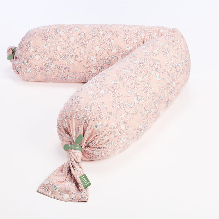 Pink floral body pillow on a white background