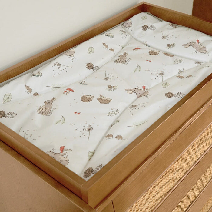Close-up view of the Japandi chest changer in light oak, showing the woodland changing mat and top.
