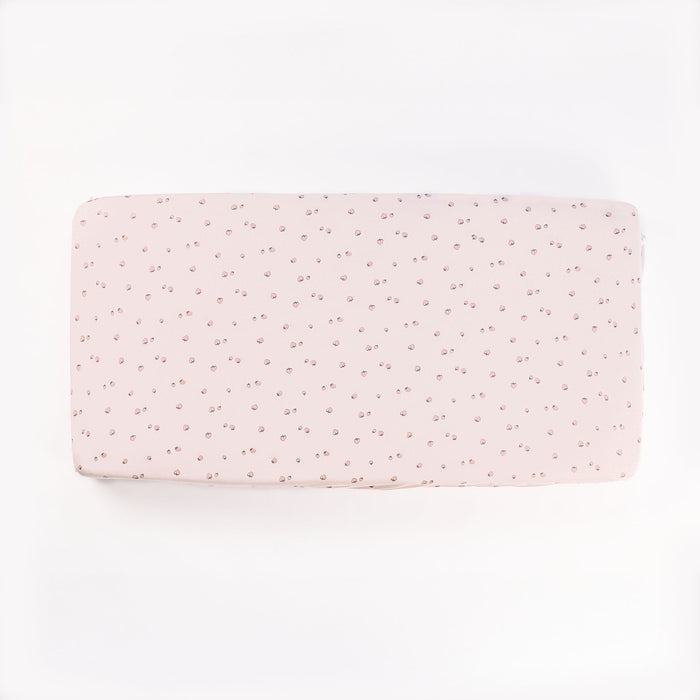 Tiny tails strawberry print fitted sheet laid flat on white background, showcasing soft blush tone and delicate scattered motif.