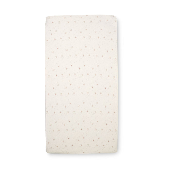 Cocoon cot bed sheets with a flower print in beige and grey tones