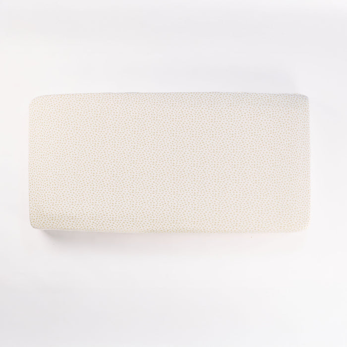 Cutout view of the Love Cats fitted sheet in cream with subtle dotted pattern, crafted in soft stretch bamboo jersey fabric