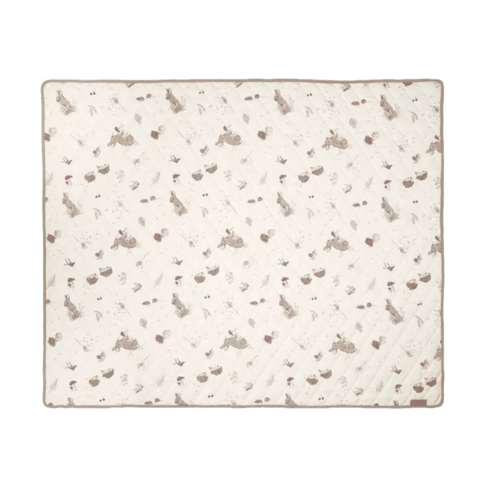 Patterned coverlet with small animal illustrations on a white background