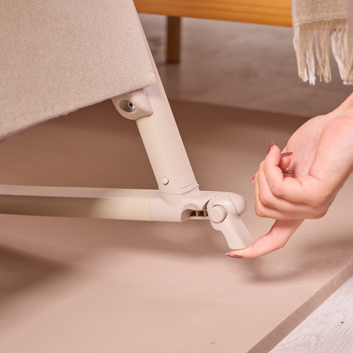 cozee air 2 in cocoa showing lockable safety brakes for when you want to keep your bedside crib stationary.