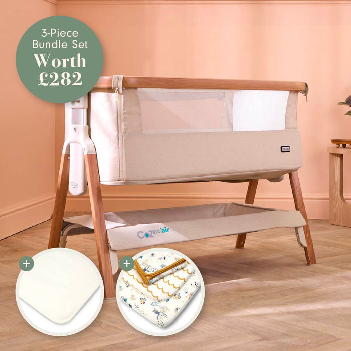 A 3-piece baby bundle set shown in a nursery-like room setting, featuring a beige crib with wooden legs, a white mesh side panel, and an included mattress protector and bedding. A green circular badge at the top left reads '3-Piece Bundle Set Worth £282'.