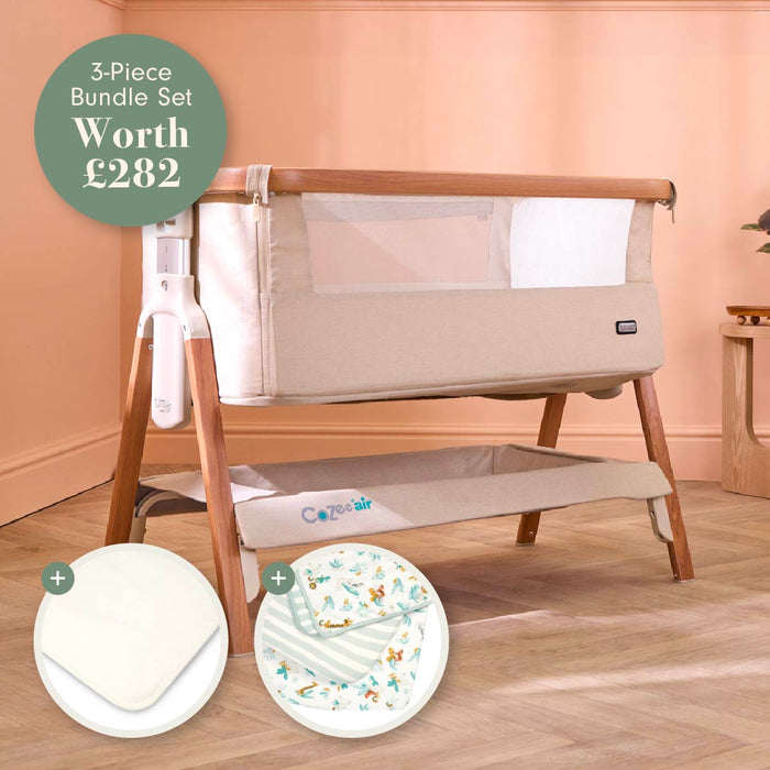 A 3-piece baby bundle set shown in a nursery-like room setting, featuring a beige crib with wooden legs, a white mesh side panel, and an included mattress protector and bedding. A green circular badge at the top left reads '3-Piece Bundle Set Worth £282'.