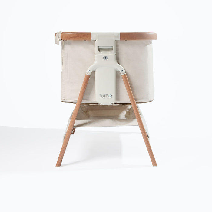 CoZee Bedside Crib Scandinavian Walnut and Ecru shown on level 1 > adjustable height positions for bedside compatibility