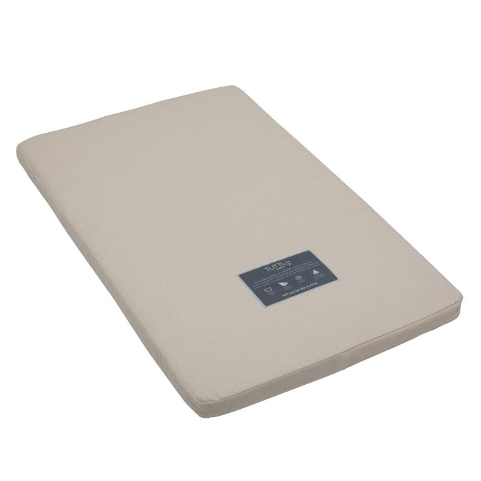 Angled cutout view of the CoZee mattress with natural cover, designed with coir and wool layers for breathable, eco-friendly support.