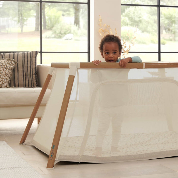 CoZee Go Travel Cot Scandinavian Walnut and Ecru > breathable mesh sides for safe and secure playtime