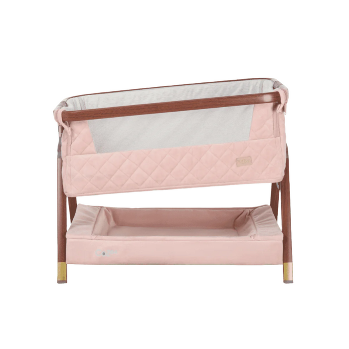 CoZee Luxe Mini Me crib in walnut and blush set in incline mode, highlighting breathable mesh panel and supportive angled base