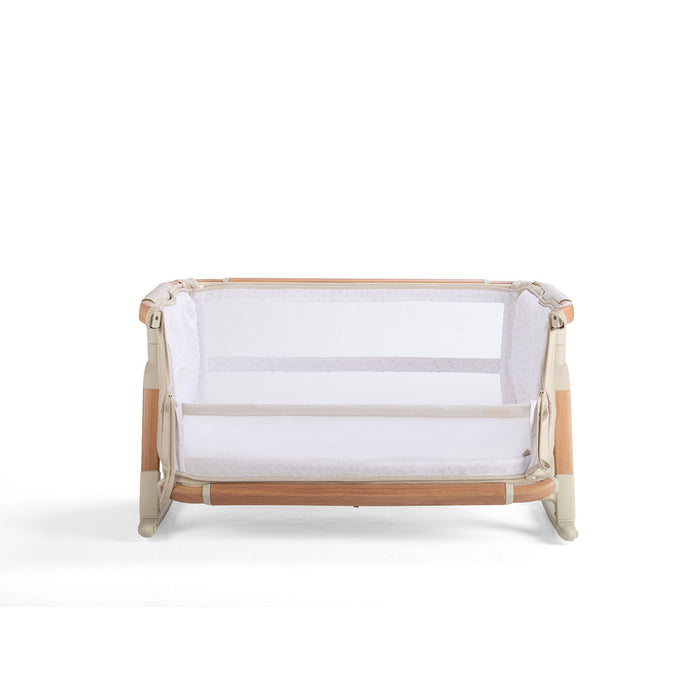 Front cutout of the CoZee Scandi bassinet with lowered side panel, showcasing mesh sides and wooden frame