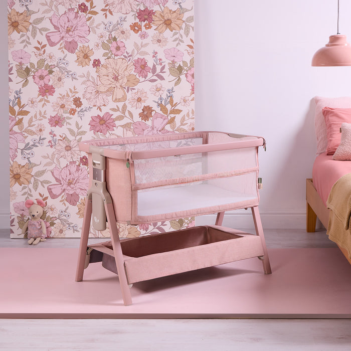 cozee zen blush shown at an angle in a well lit bedroom with pink floral tones