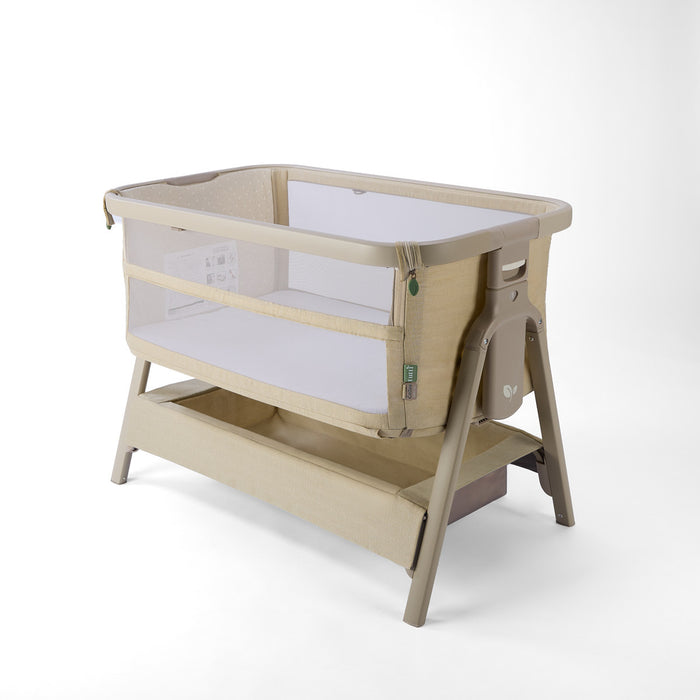 CoZee Zen sand baby crib with white mattress on a white background
