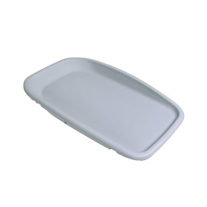 Angled cutout of the Cushi baby changing mat in cloud grey finish with raised edges for safety and smooth contoured design