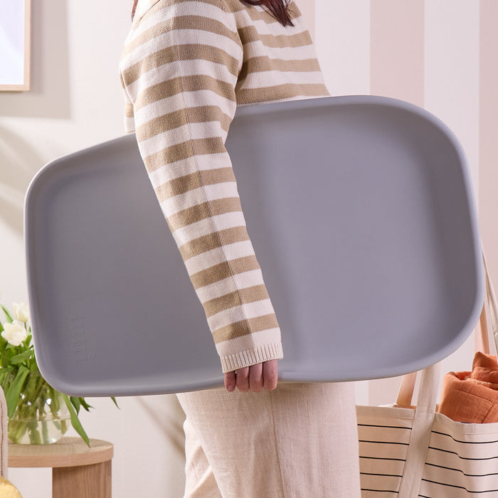 Close-up of the Cushi mini changing mat in cloud, highlighting smooth wipe-clean surface and gently contoured shape for easy care