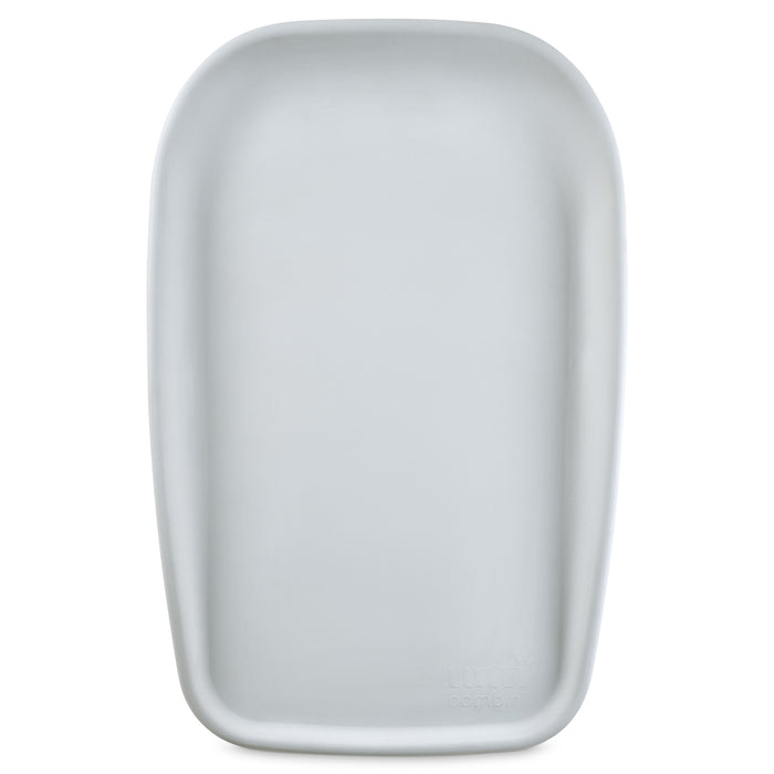 Front view of the Cushi mini baby changing mat in cloud, featuring softly contoured edges and a smooth, wipe-clean surface.