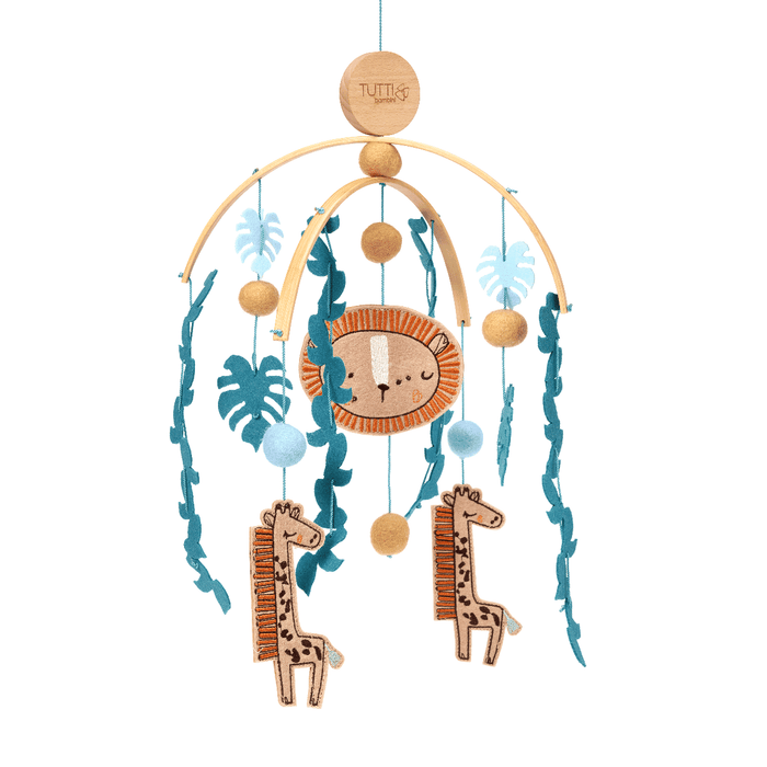 Cutout view of the Run Wild felt nursery mobile with giraffes, lion face and leafy felt elements suspended from smooth wooden arches