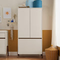 A modern white sand and warm walnut wardrobe with handleless doors and a hanging rail, placed in a room with a yellow wall and a wicker basket on the floor.
