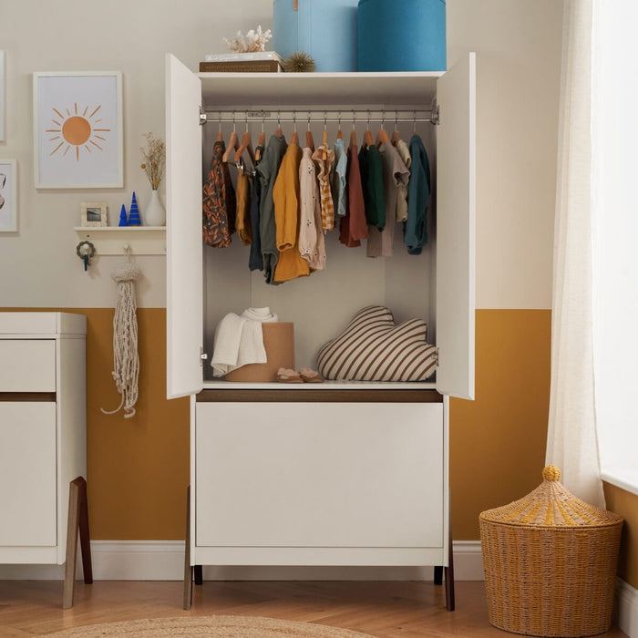 Wardrobe with doors open showcasing interior storage shelves and hanging rail