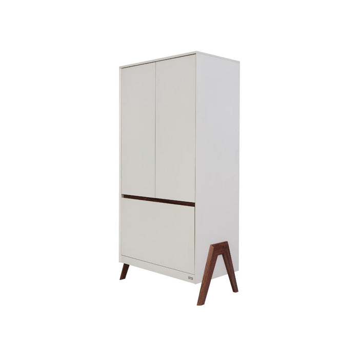 Angled cutout view of the Fuori wardrobe in white sand and warm walnut, highlighting tapered legs, smooth finish and contemporary silhouette