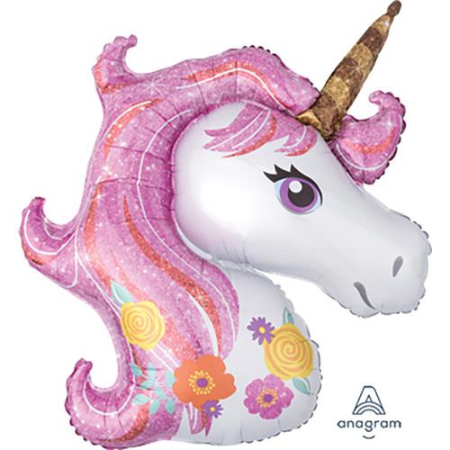 A large, glittery pink unicorn-shaped balloon with floral details and a golden horn.