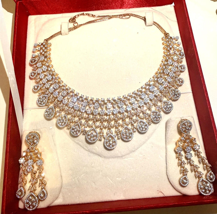 Gold-plated CZ floral necklace and chandelier earring set – jewelry detail