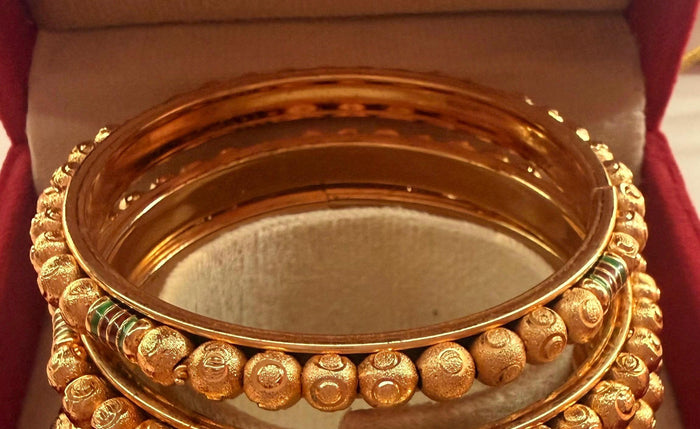 Gold-tone enamel bangle set size 2.8 – textured bangle detail