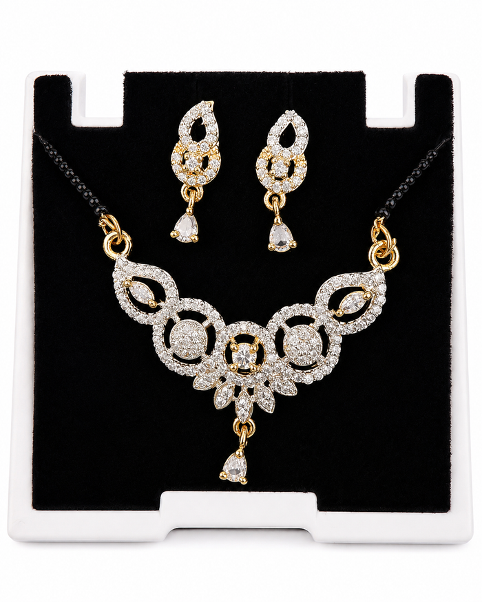 Gold-tone floral mangalsutra pendant and earring detail