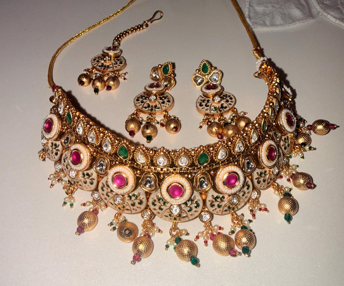 Gold-tone Kundan bridal choker set – pink and green accent detail