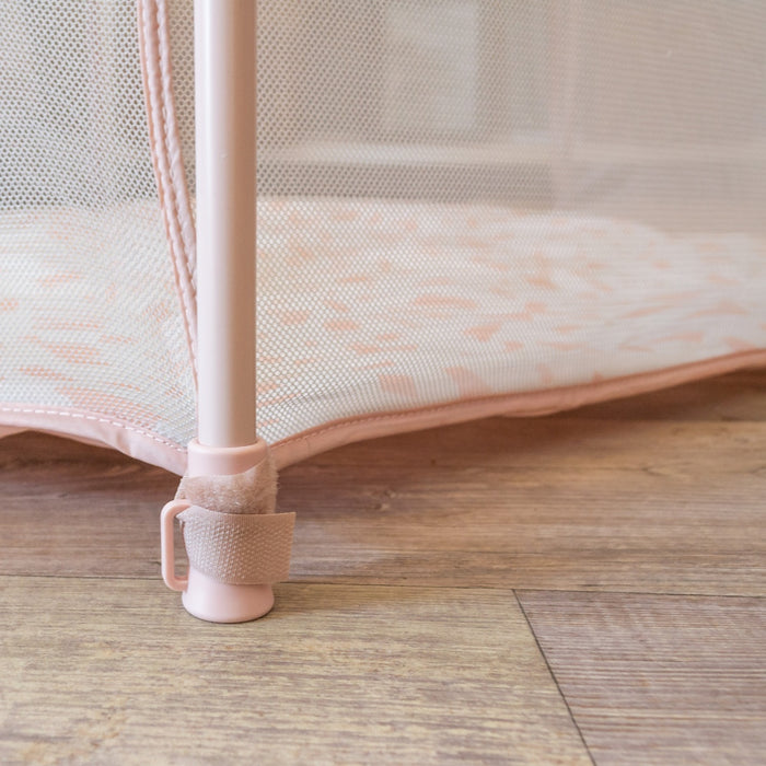 Close-up of a single Hexa Playpen leg with secure base attachment and velcro strap securing mesh to frame