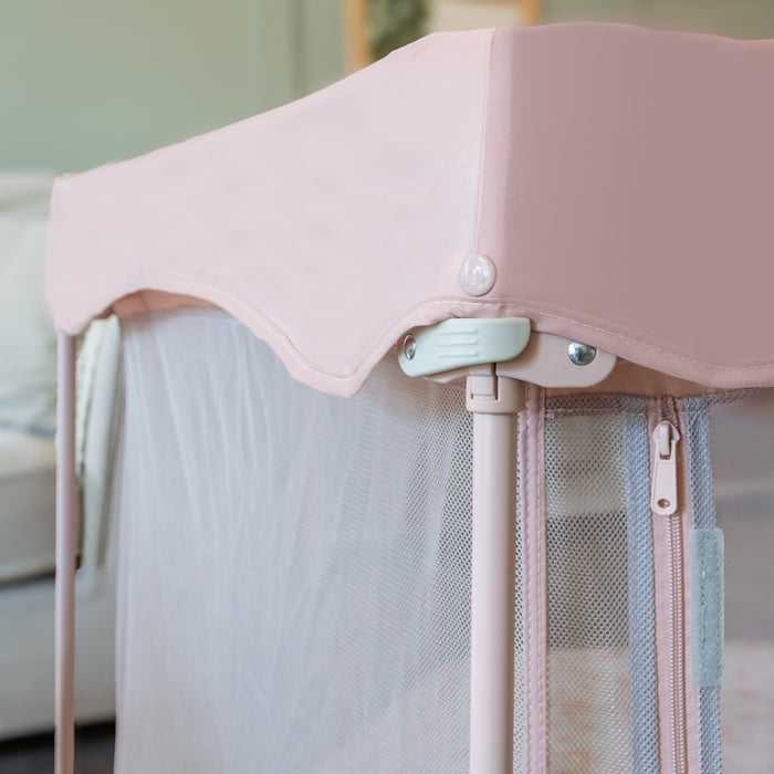 Detailed close-up of the Hexa Playpen corner in Gumdrop Terrazzo showing locking mechanism and soft curved fabric canopy design