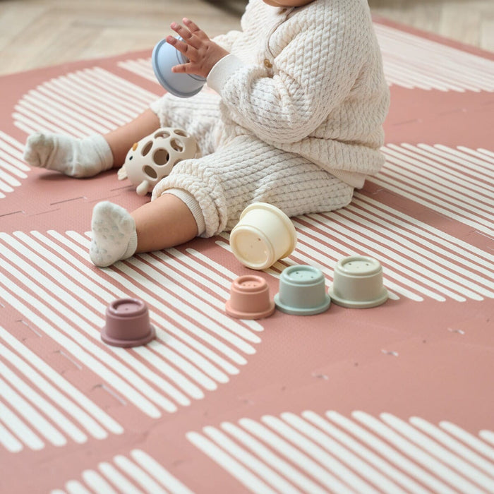 Close-up detail of the print on the Orbital Nutmeg Baby Infinity Playmat.