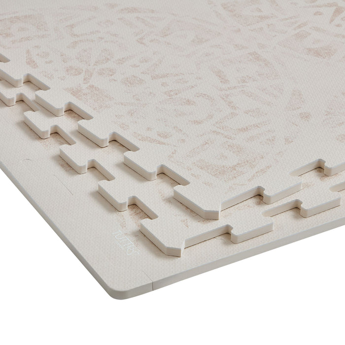 Detailed view of the edges of the Infinity Playmat in Bedouin Sand.