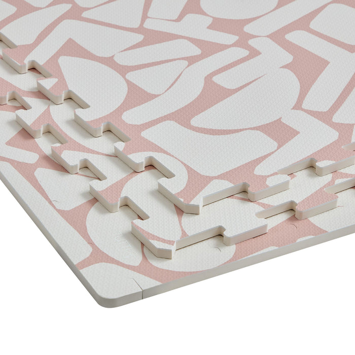 Detailed view of the edges of the Infinity Playmat in Oddity Blush