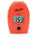 TAS Iron Checker HC, an orange portable colorimeter for precision testing ppm levels.