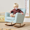 Toddler sitting in the Jonah Mini Me rocking chair in Ocean Stone, showcasing the comfortable seat height and relaxed arm support