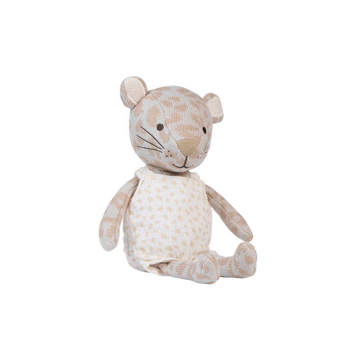 A plush stuffed animal shaped like a small leopard, made from beige and cream spotted fabric, sitting against a plain white background.