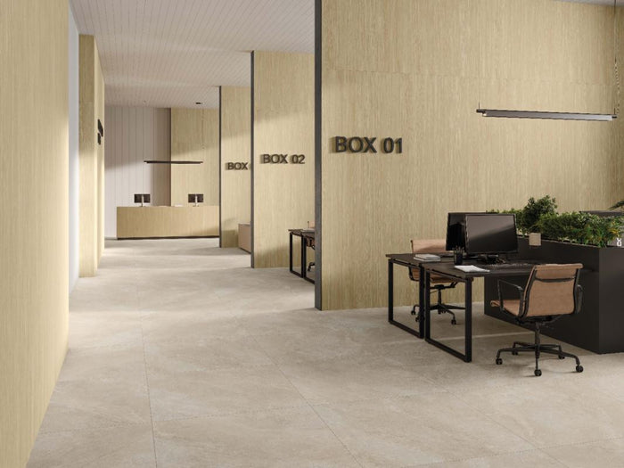 Modern office interior with desks featuring Spanish Porcelain Wood look tile on the walls.