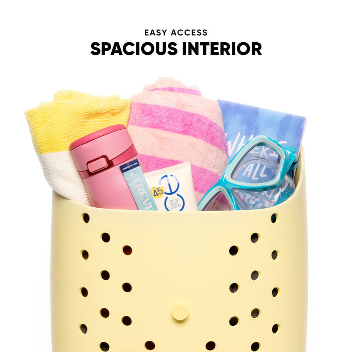 Pale yellow perforated storage basket filled with colorful beach items including pink water bottle, striped towels, turquoise swim goggles, and sunscreen on white background. Text reads "Easy Access" and "Spacious Interior."