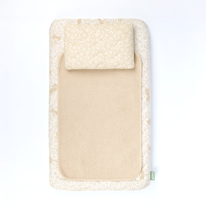 Beige baby changing mat with animal print cover on a white background