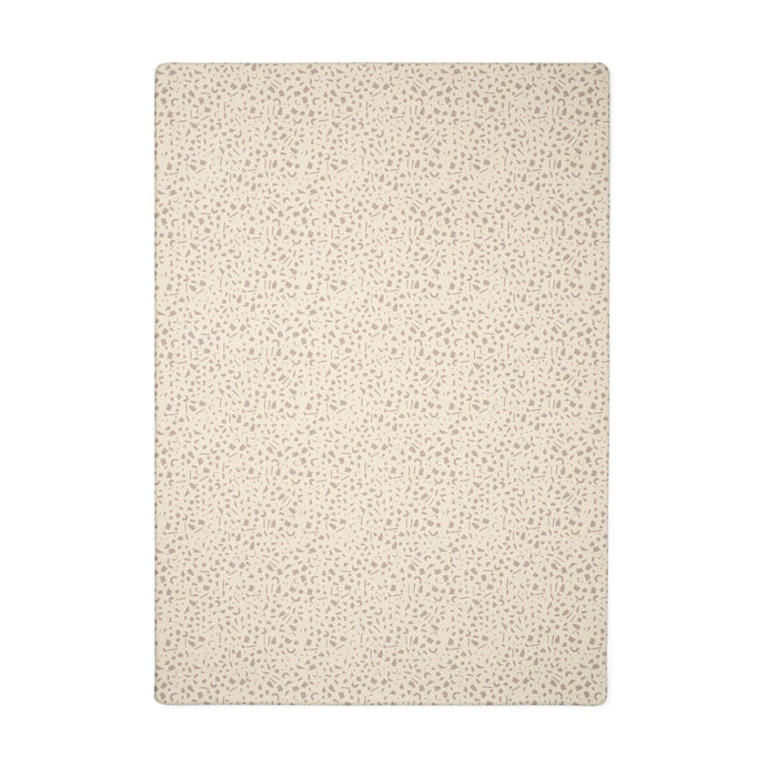 Cutout of the Terrazzo play mat in warm neutral tones, featuring a scattered terrazzo-style pattern across the cushioned surface.