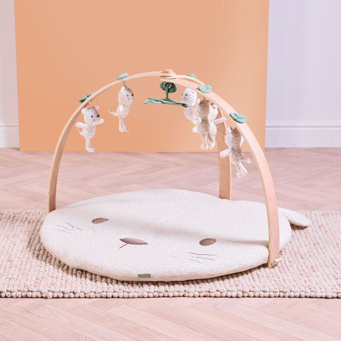 Luxury wood muslin play gym in Love Cats design with padded character mat and hanging toys on natural wooden frame.