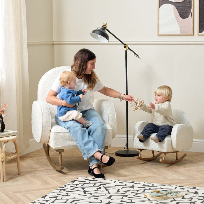 Lifestyle view of the Micah Mini Me Rocking Chair in Fresh Cream with parent and children using matching chairs, illustrating family-friendly and interactive design.